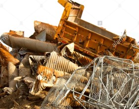 scrap-heap-of-rusting-discarded-drainage-pipes-and-other-industrial-E54H75
